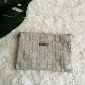 Carolina Herrera leather monogram clutch